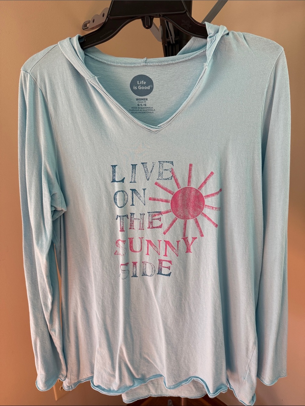 Life Is Good Light Blue Hooded Long Sleeve Top with Pink Sun Graphic